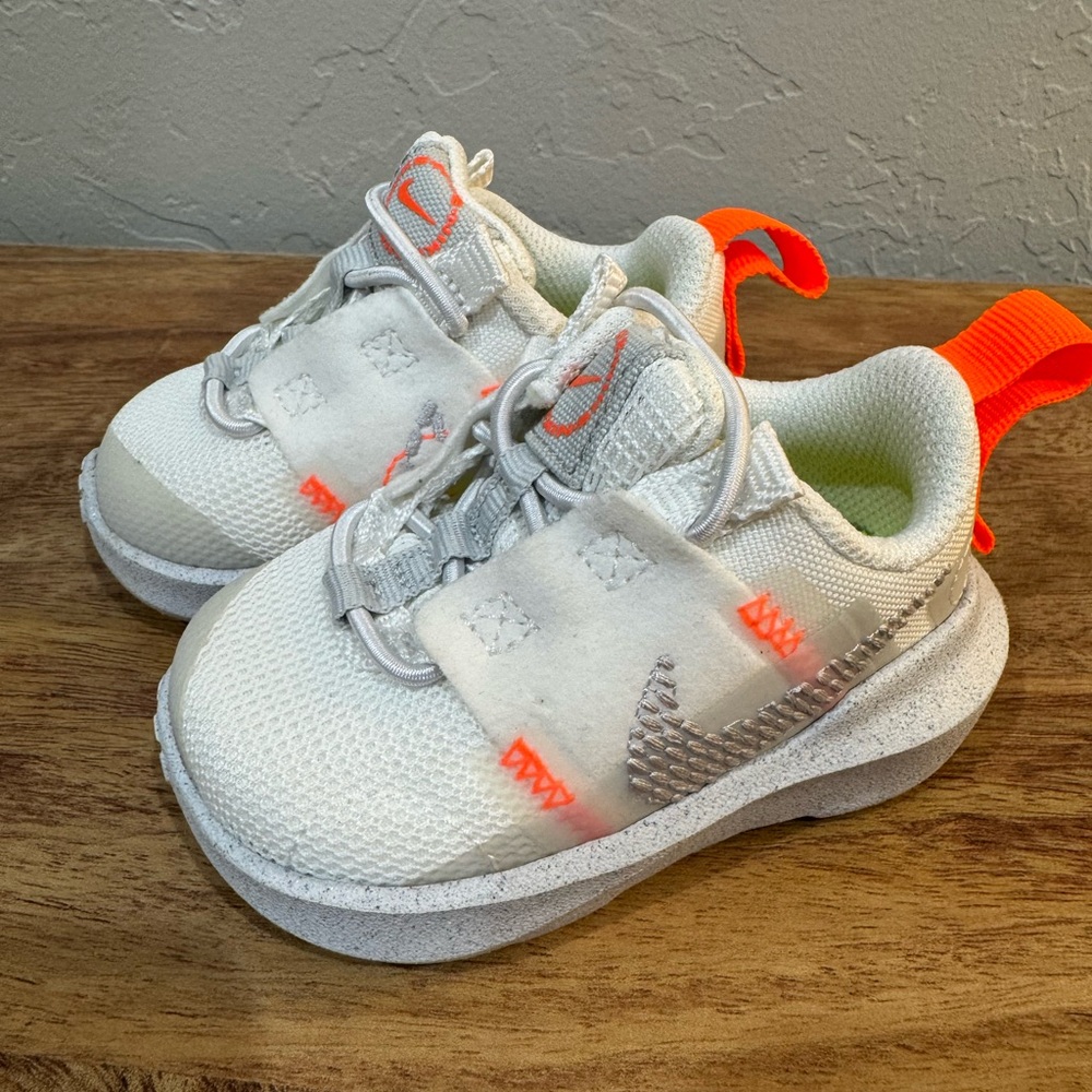 Kids White and Orange Nike Shoes